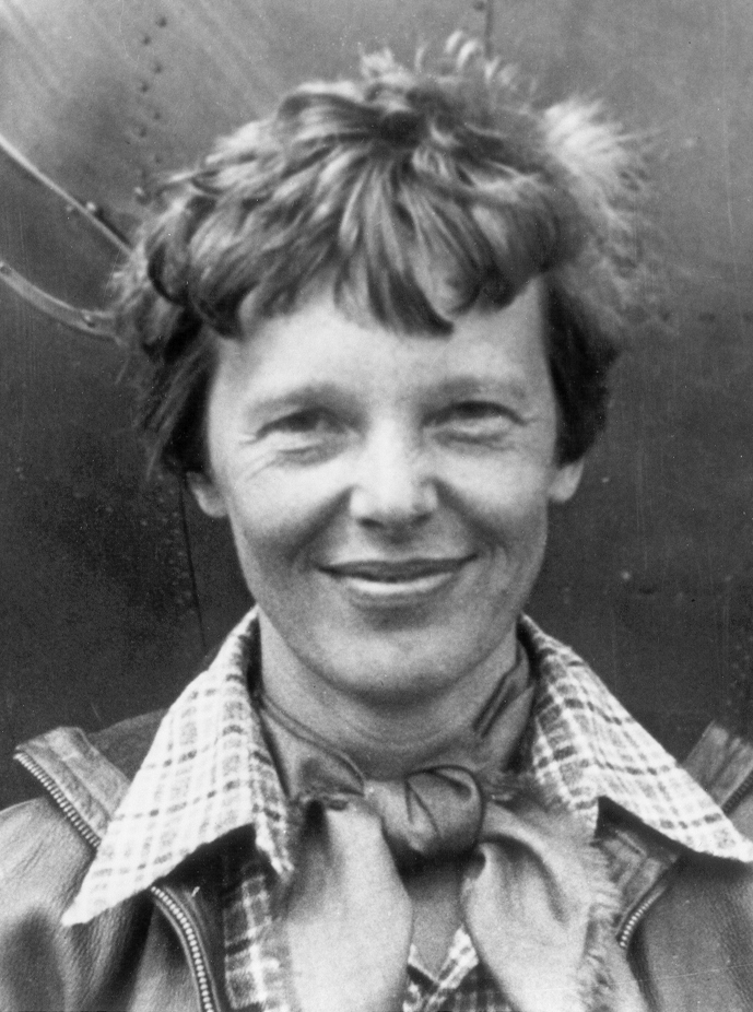 Amelia Earhart standing in front of her Lockheed Electra before the 1937 world flight