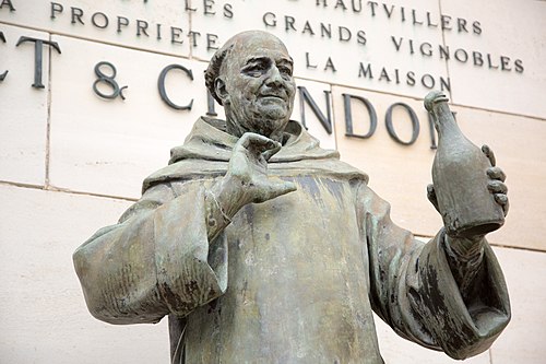Statue of Dom Pierre Pérignon holding a bottle at Épernay in Champagne.